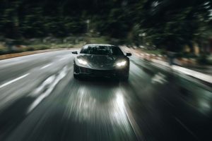 A speeding car approaches on a head-on collision trajectory 